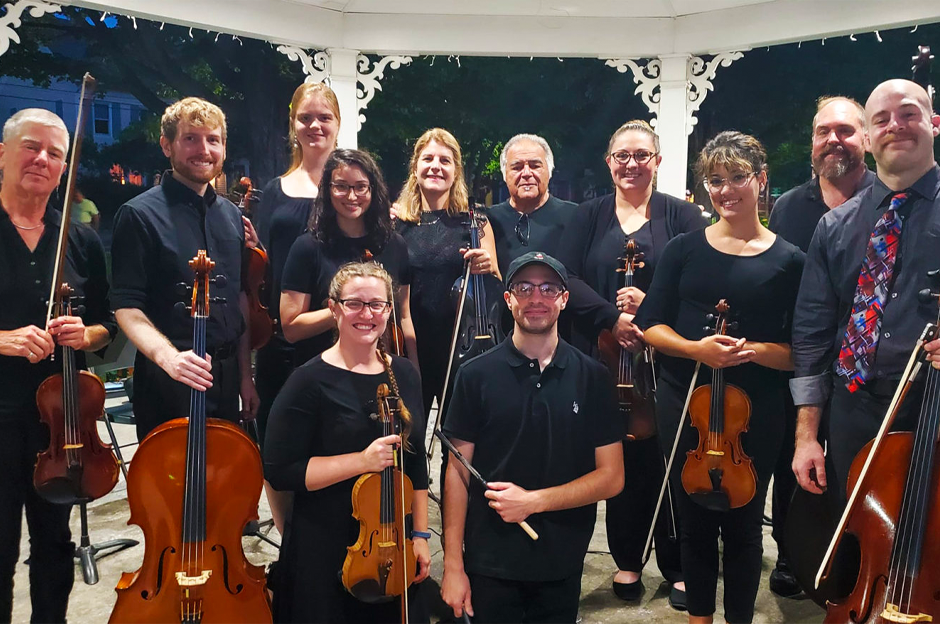 group of orchestra players with their instruments