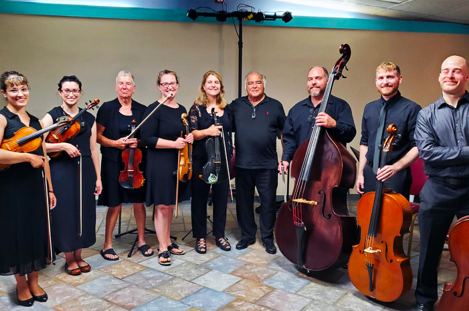 group of orchestra players with their instruments