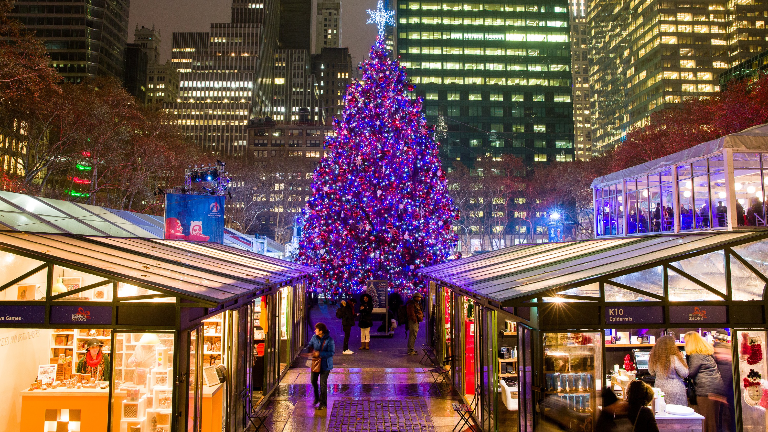 Bryant Park, Christmas Tree in middle of park surrounded by many lights and shops