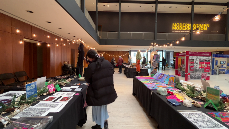 Woman walking around art market