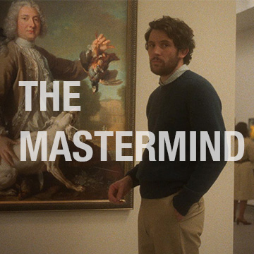 Man standing in front of art in gallery