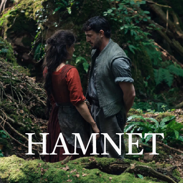 man and woman looking at each other in the woods