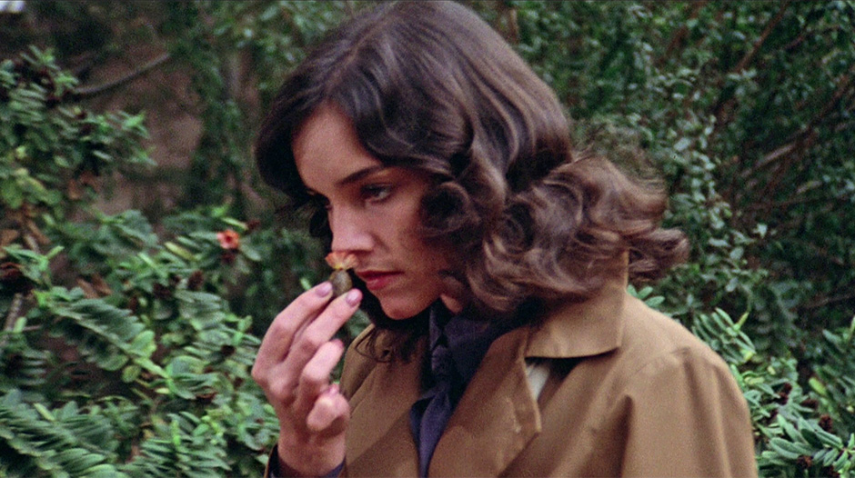 woman smelling alien flower