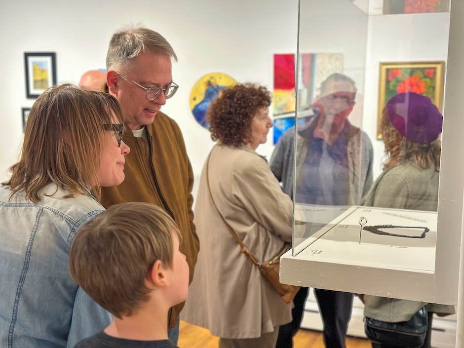 people looking at art