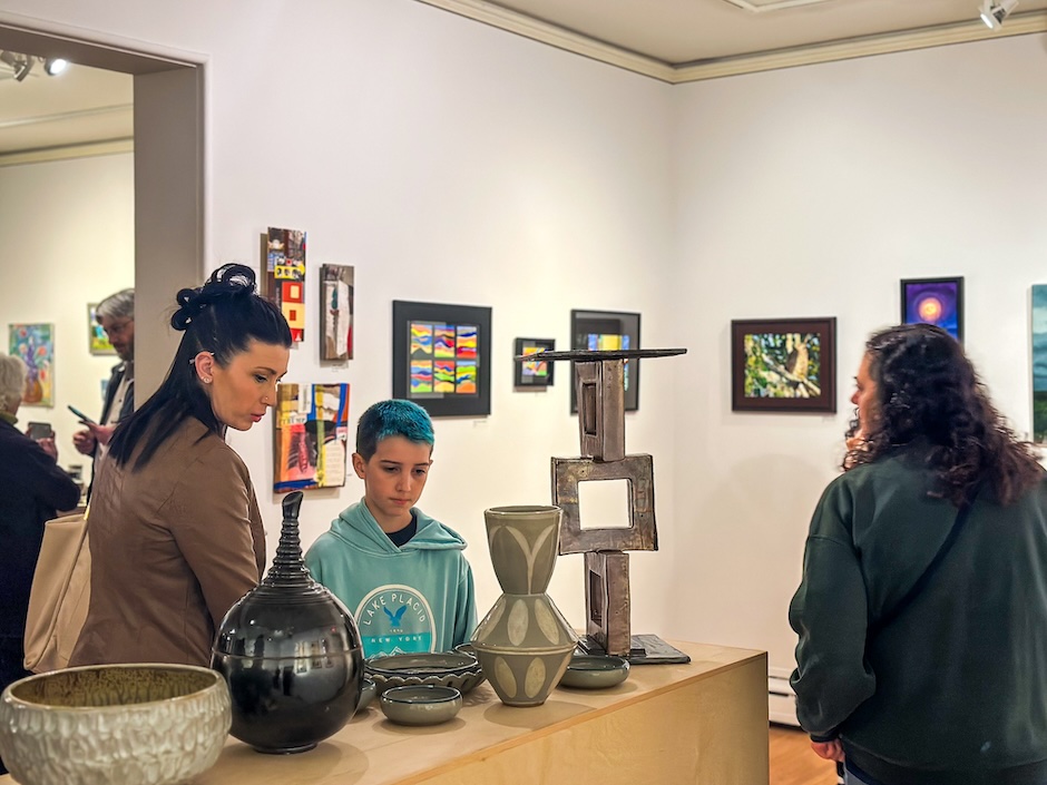 people looking at art