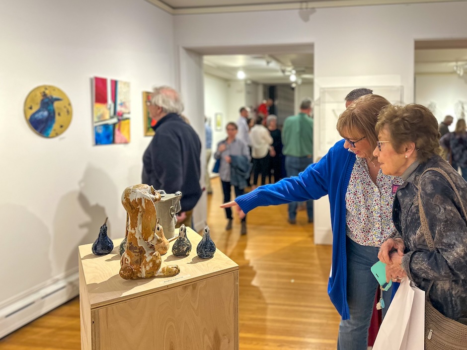 people looking at art