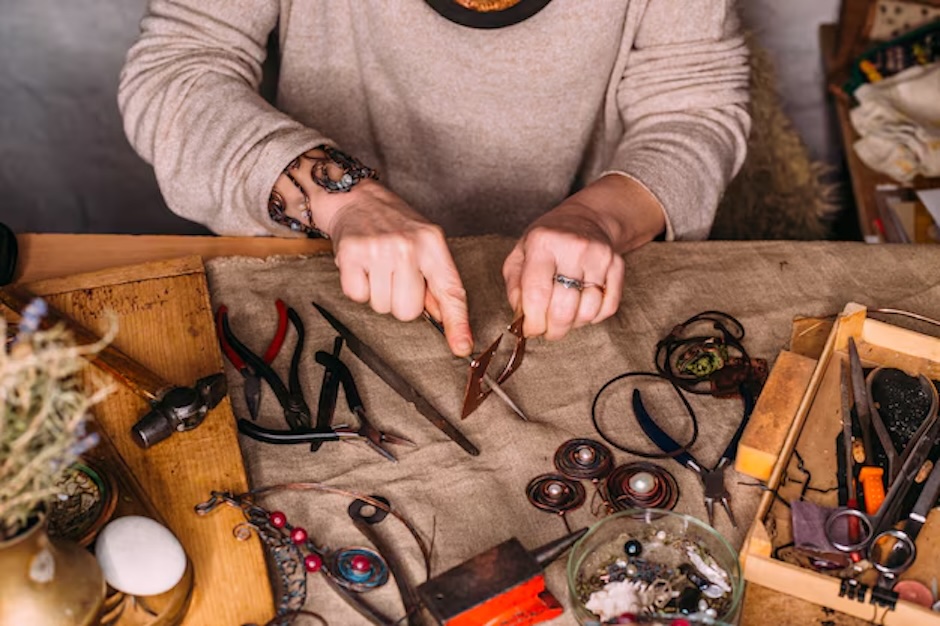 feamle making copper jewelry