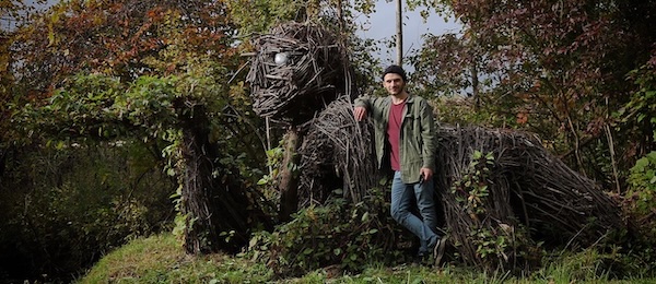 stick sculpture with artist