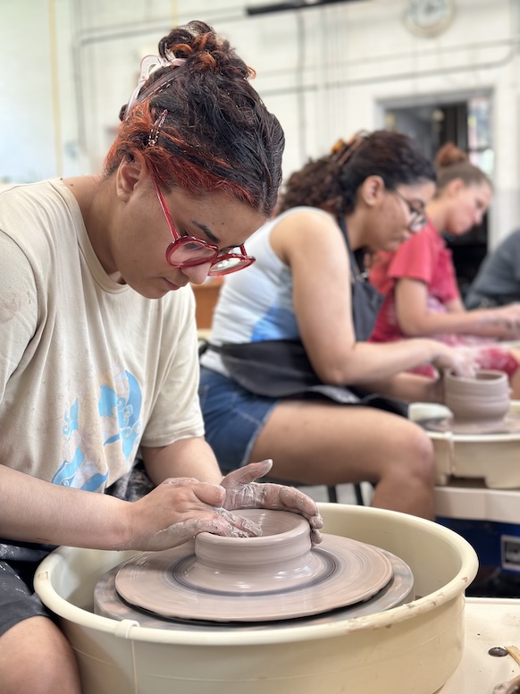 woman making pottery