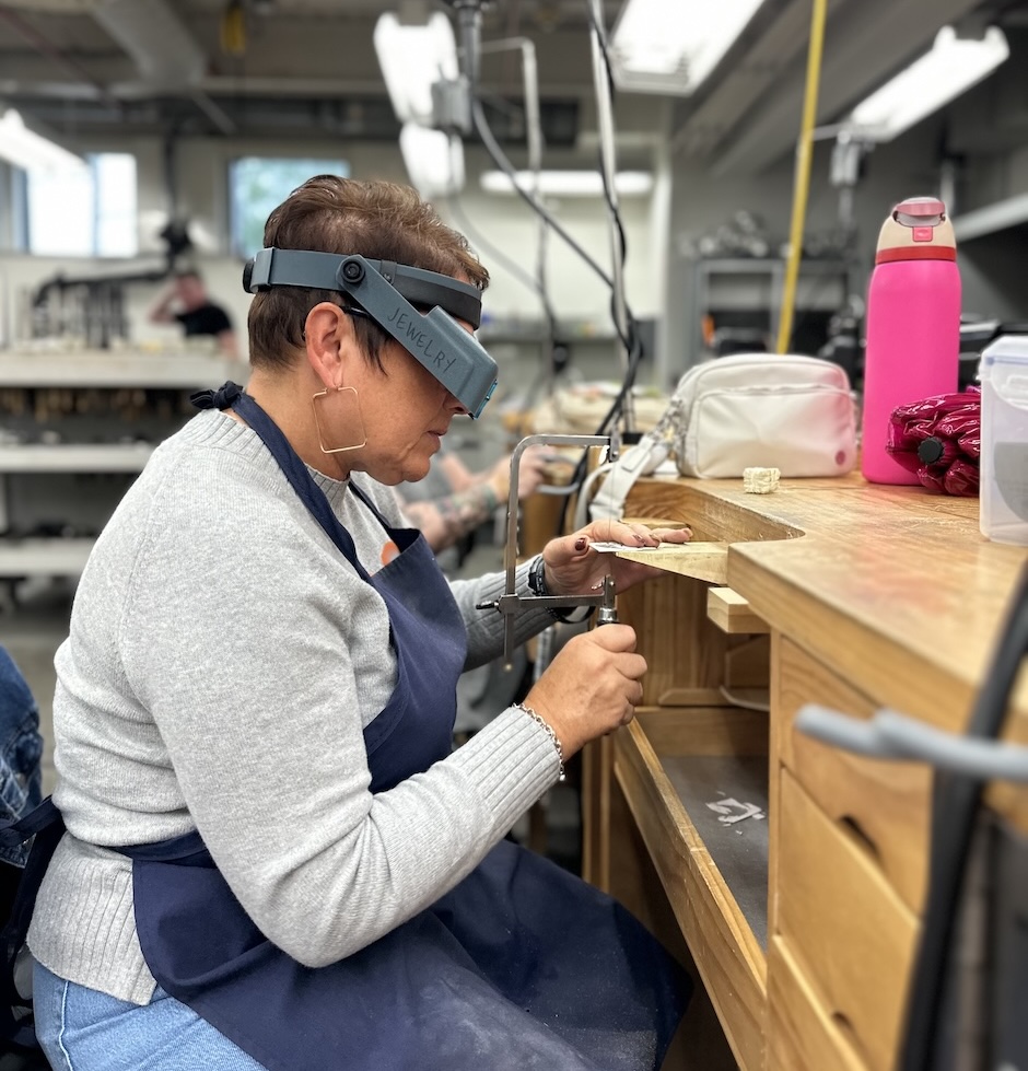 woman making jewelry