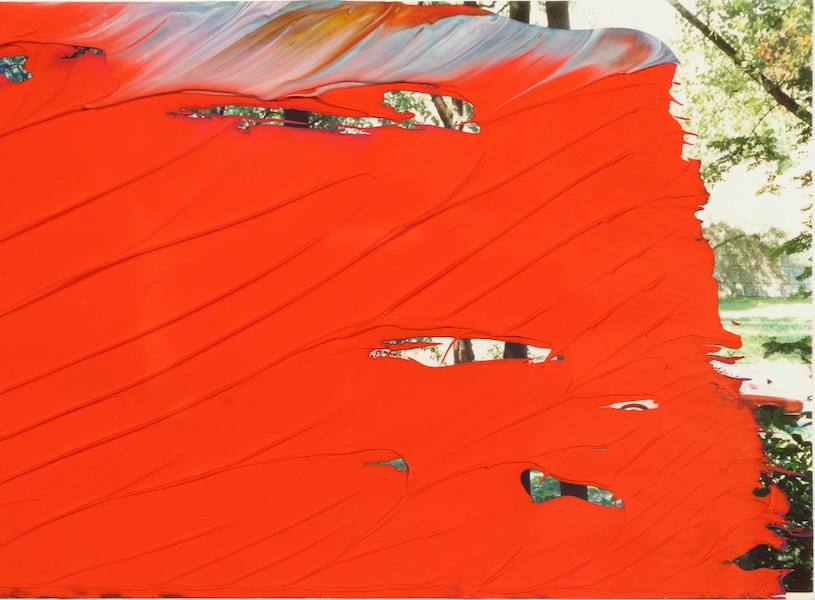 red oil paint on photograph
