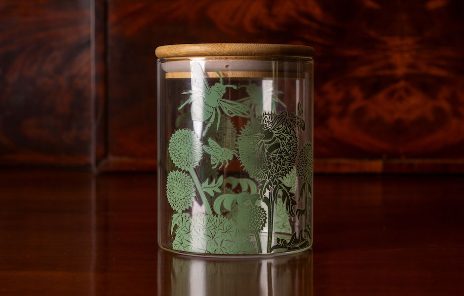 wood stopper glass jar with green bug and flora pattern