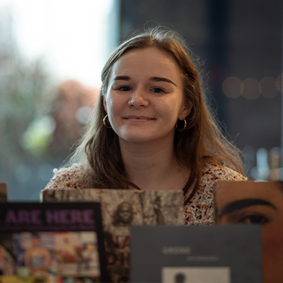 person smiling toward camera working an event 